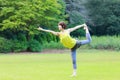 Portrait of Japanewe woman doing yoga Lord of the Dance Pose Royalty Free Stock Photo