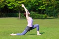 Portrait of Japanewe woman doing yoga  warrior I pose Royalty Free Stock Photo