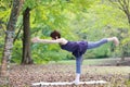 Portrait of Japanewe woman doing yoga  Warrior III Pose Royalty Free Stock Photo
