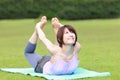 Portrait of Japanewe woman doing yoga frog pose Royalty Free Stock Photo