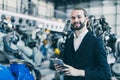 Portrait jewish businessman standing happy in machine factory warehouse for success CEO business industry owner