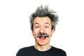 Portrait of jocular aging man with grey long hair smiling with open mouth, in Einstein manner. Isolated on background Royalty Free Stock Photo