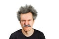 Portrait of jocular aging man wrinkles his nose from sour on his face in Einstein manner. Isolated on background Royalty Free Stock Photo