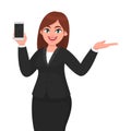 Portrait of joyful businesswoman showing blank screen mobile, cell or smart phone & gesturing hand to copy space side away.