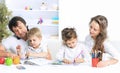 Portrait of a joyful family using a laptop sitting on sofa home Royalty Free Stock Photo