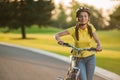 Portrait of joyful girl with bicycle outdoors. Royalty Free Stock Photo