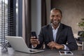 Portrait of joyful mature african american boss in business suit, senior businessman smiling and looking at camera with Royalty Free Stock Photo