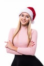 Portrait of joyful pretty woman in red santa claus hat isolated on white background. Beautiful girl looking happy and excited. Hap Royalty Free Stock Photo