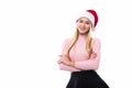 Portrait of joyful pretty woman in red santa claus hat isolated on white background. Beautiful girl looking happy and excited. Hap Royalty Free Stock Photo