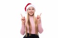 Portrait of joyful pretty woman in red santa claus hat isolated on white background. Beautiful girl looking happy and excited. Hap Royalty Free Stock Photo