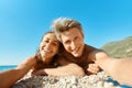 Portrait joyful smiling couple on sunny beach, making selfie picture on romantic honeymoon vacation