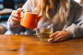 Portrait of a joyful teengirl enjoying a cup of tea at cafe Royalty Free Stock Photo