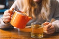 Portrait of a joyful teengirl enjoying a cup of tea at cafe Royalty Free Stock Photo