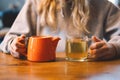 Portrait of a joyful teengirl enjoying a cup of tea at cafe Royalty Free Stock Photo