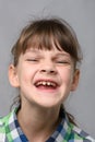 Portrait of a joyfully smiling ten-year-old girl of European appearance, close-up