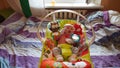 Portrait of just born baby in pink blouse lying in a cradle