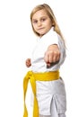 Portrait of a karate girl in kimono with yellow belt ready to fight Royalty Free Stock Photo