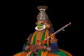 Portrait of a Kathakali Hindu temple character before the black background