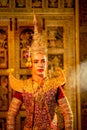 Portrait of Khon or traditional Thai classic masked from the Ramakien with man wear beautiful traditional dress and Thai paintings