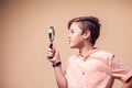 A portrait of kid boy holding magnifier. Children and knowlage concept Royalty Free Stock Photo