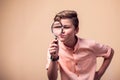 A portrait of kid boy holding magnifier. Children and knowlage concept Royalty Free Stock Photo