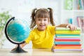 Portrait of kid girl considers Globe Royalty Free Stock Photo