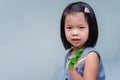 Portrait kid girl holds leaf in her hand. Empty space. Happy children. Sweet smile