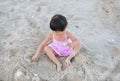 Portrait Kid girl playing sand at the beach Royalty Free Stock Photo