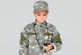 portrait of kid in military uniform with stop watch in hand Royalty Free Stock Photo