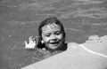 Portrait of kid in swimming pool. Cute boy in the water playing with water. Royalty Free Stock Photo