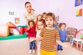 Portrait of kids group boys girls and nurse Royalty Free Stock Photo