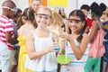 Portrait of kids holding laboratory flask in laboratory Royalty Free Stock Photo