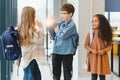 Portrait of kids standing in elementary school hallway Royalty Free Stock Photo