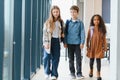 Portrait of kids standing in elementary school hallway Royalty Free Stock Photo