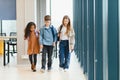 Portrait of kids standing in elementary school hallway Royalty Free Stock Photo
