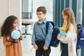 Portrait of kids standing in elementary school hallway Royalty Free Stock Photo