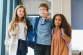 Portrait of kids standing in elementary school hallway Royalty Free Stock Photo