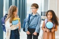 Portrait of kids standing in elementary school hallway Royalty Free Stock Photo