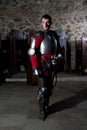 Portrait of Knight in Armor Standing in Old Monastery Royalty Free Stock Photo