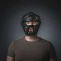 Portrait of krav maga practitioner on grey background