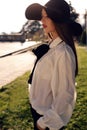 Portrait of ladylike woman in elegant shirt and felt hat Royalty Free Stock Photo