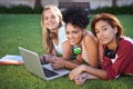 Portrait, laptop or friends on grass at college, campus or together with online course, smile or group. University