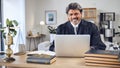 Portrait, laptop and a senior man judge in his office for legal research or planning for a trial. Computer, case file
