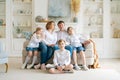 Portrait large family spending time together at home. They are happily sitting Royalty Free Stock Photo