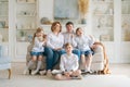 Portrait large family spending time together at home. They are happily sitting Royalty Free Stock Photo