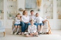 Portrait large family spending time together at home. They are happily sitting Royalty Free Stock Photo