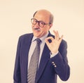 Portrait of last day at work of happy senior businessman excited about his retirement Royalty Free Stock Photo