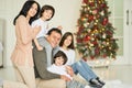 The greatest treasure. Portrait of latin family, children smiling at camera while posing with their parents at home Royalty Free Stock Photo