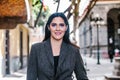 Portrait of a latin woman walking in the streets of a colonial city in latin america