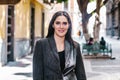 Portrait of a latin woman walking in the streets of a colonial city in latin america